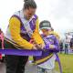 Coen Drysdale, who was diagnosed with cancer when he was 18-months-old, with his mother Amanda, cuts the ribbon to start Sutherland Shire Relay for Life 2024. Picture by John Veage