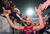 Max Gawn celebrates with Demons fans after playing a leading role in the defeat of the Geelong Cats. (Morgan Hancock/AAP PHOTOS)