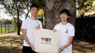 Hurstville's Andrew Wang and Daniel Su launched non-profit organisation Help Elevate Youth (HEY), which supports young people in need by distributing care packs. Picture by Chris Lane
