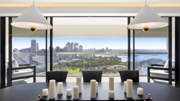 Dinner with a view is on the menu in the 40th floor apartment with views over Sydney Harbour. Pic: Supplied