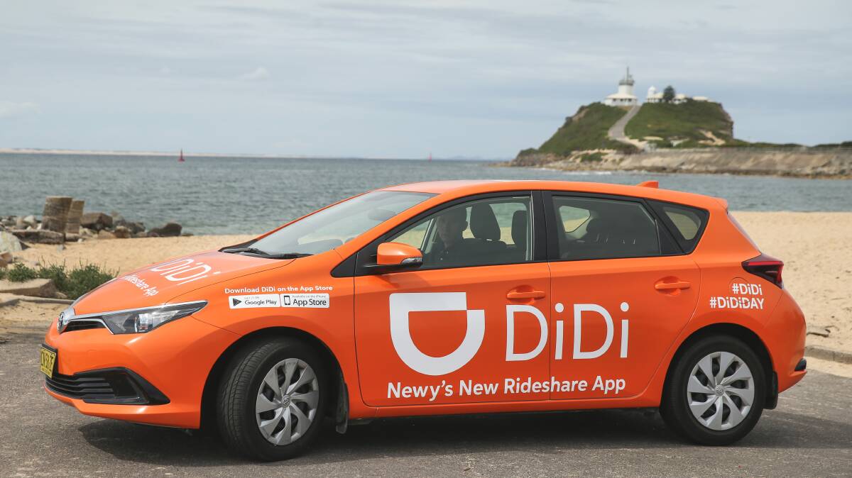 Didi rideshare driver parked near Newcastle's Nobbys Beach. Picture Marina Neil