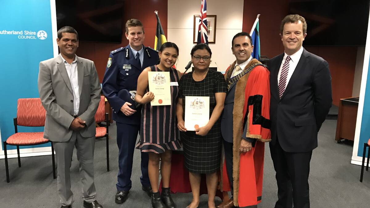 New citizens: Sutherland Shire mayor Carmelo Pesce and Cronulla MP Mark Speakman (right) welcomed the shire's newest citizens today.