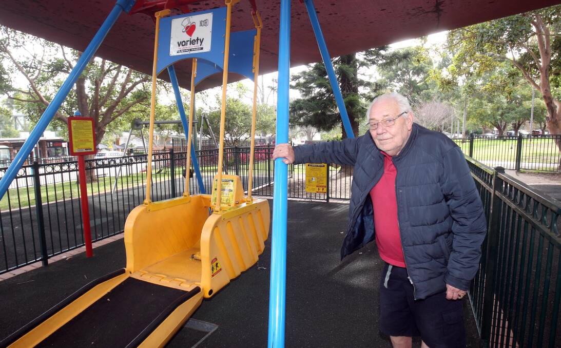 Liberty Swing designer Wayne Devine with one of his wheelchair accessible swings at Oatley Memorial Park. Picture by Chris Lane