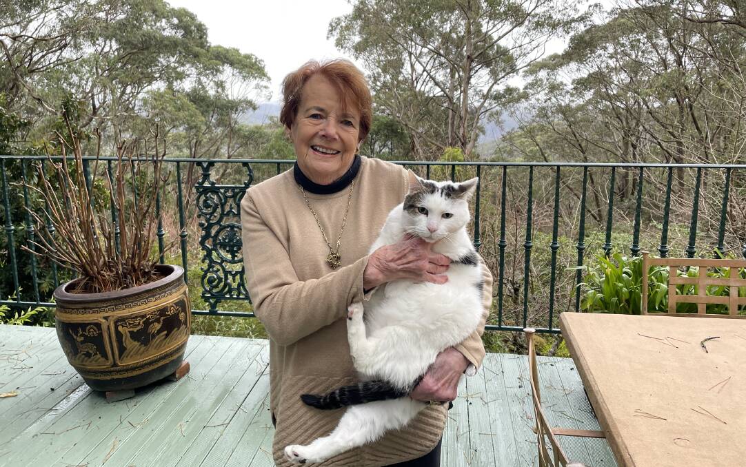 Mary Holt OAM and Timothy, her 11-year-old rescue cat, at her Mt Wilson home. Picture Jennie Curtin
