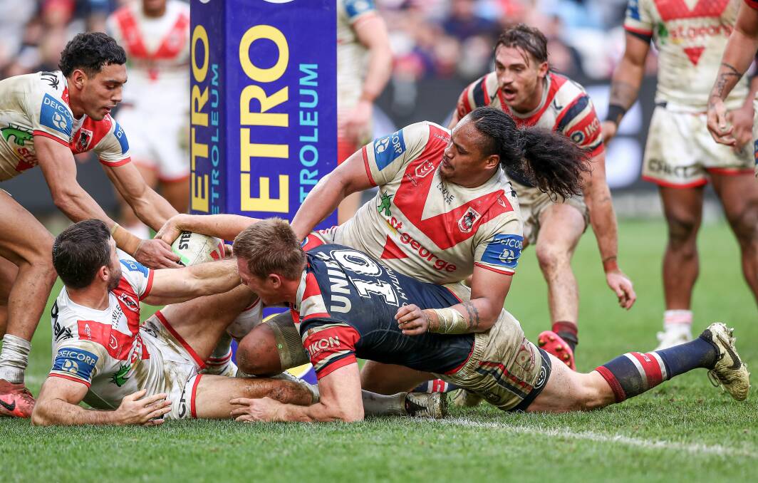 Sydney Roosters Lindsay Collins was held up over the line here but they still cruised to a 40-12 victory over the Red V at Allianz Stadium. Picture NRL Images