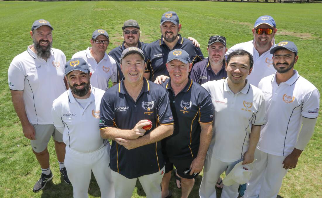 De La Salle Kingsgrove Cricket Club 1000 wicket bowler Paul Compton (centre) and his team mates. Picture John Veage