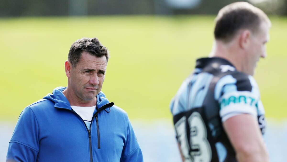 Black, white and blue through and through: Shane Flanagan casts an eye over captain Paul Gallen at training. Picture: Chris Lane