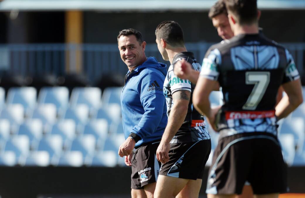 The coach: Shane Flanagan enjoys a laugh with hooker Michael Ennis at training on Sunday. Picture: Chris Lane