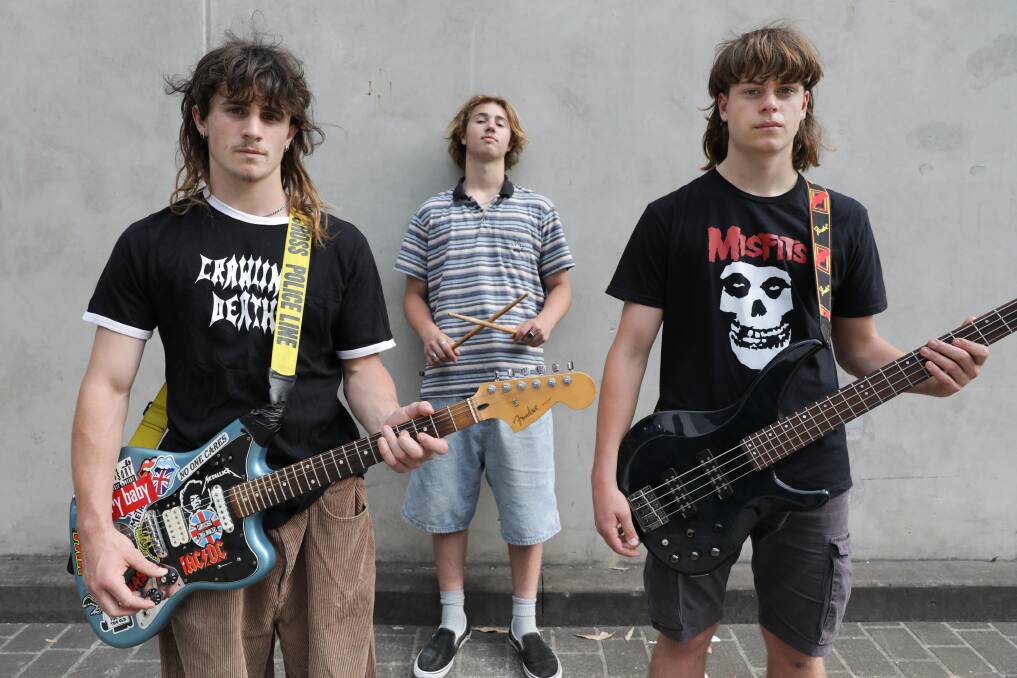 WoodHill band members Noah McCallum, 17, on vocals/guitar, Max Lizzo, 17, on bass and drummer Flynn Williams, 16. They perform their first headline act for their album launch at Caringbah Hotel on November 24. Picture by John Veage
