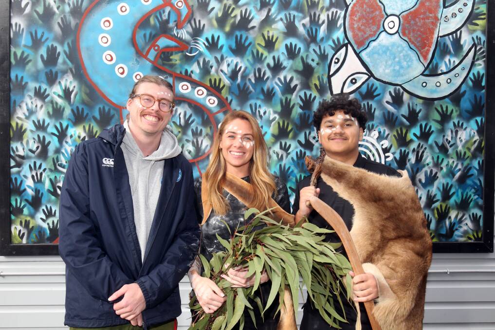 Hayley Goodrick of Djalgala Aboriginal Education with Josh Turner and Tyrell Corby for NAIDOC Week at Rockdale Public School. Picture by Chris Lane