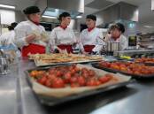 Hospitality students at St Aloysius Cronulla prepare their meal game plan in a culinary cook-up, attended by executive chefs and guests. Picture supplied