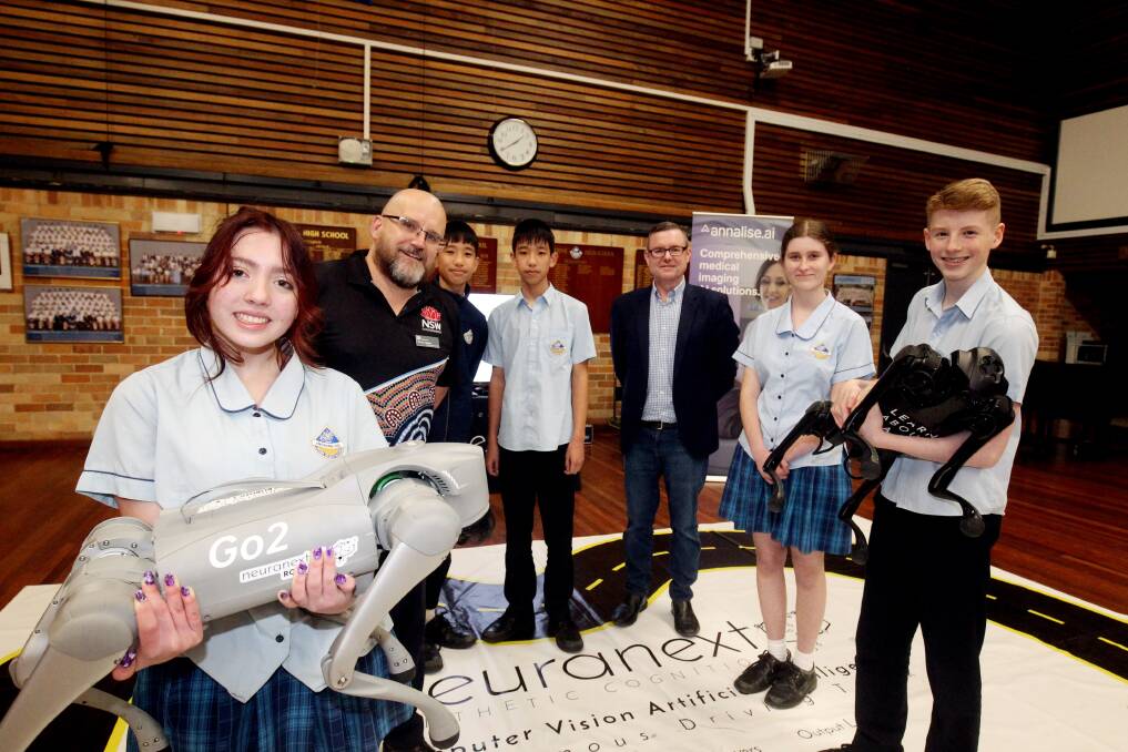 Neuranext Managing Director Adrian Tyson, and Regional Industry Education Partnerships Senior Project Officer Trevor Adams bring AI to Engadine High School, with students Sacorra OCallaghan, Hanxuan Wu, Hanyu Wu, Tara Gavagan and Zac Montgomery getting a close-up lesson on artificial intelligence. Picture by Chris Lane 