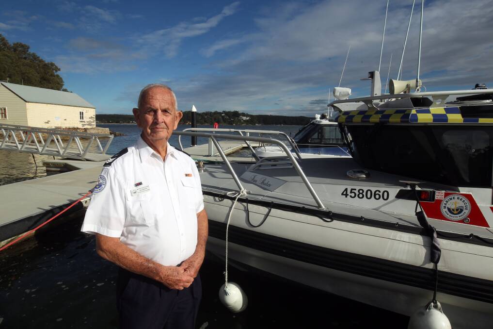 Ian Baker receives a King's Birthday Honour - Emergency Services Medal for his dedicated service to Marine Rescue NSW. He is pictured with the boat that was named after him. Picture by Chris Lane