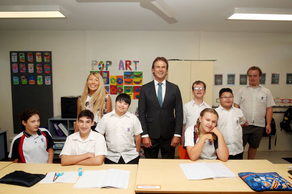 Port Hacking High School Head of Special Education Abigail Gassman and Principal Rick Turansky with students. The school has an extra class in 2024 because of growing demand. Picture by Chris Lane