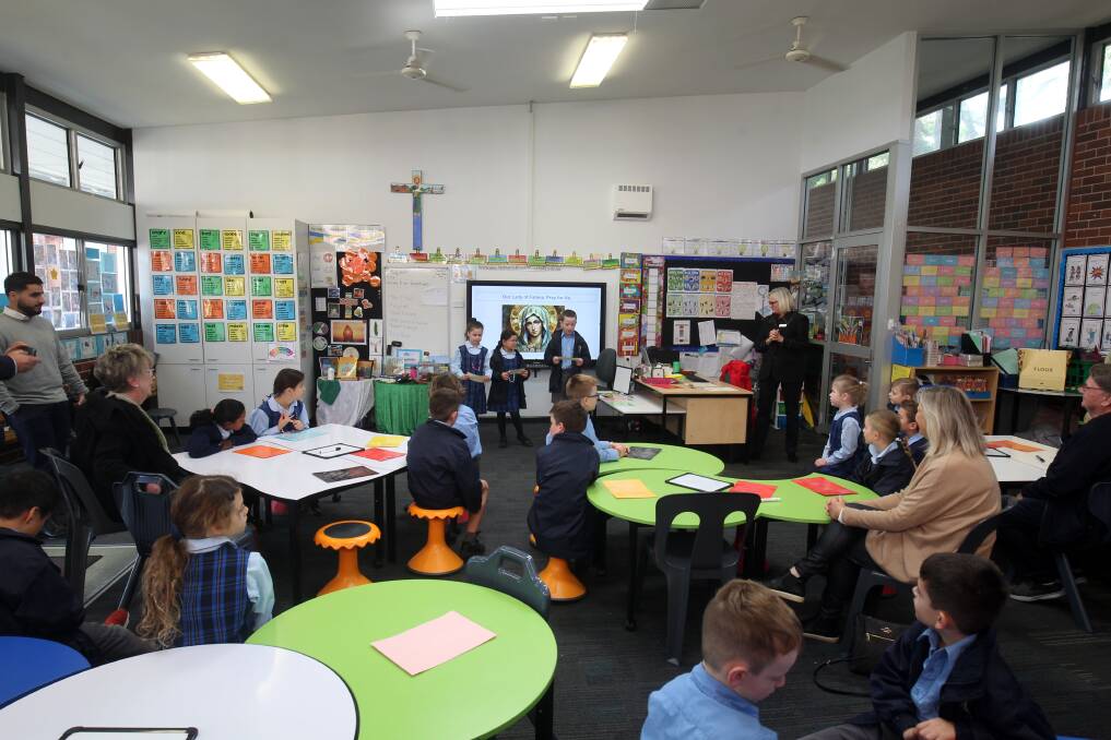Students present a lesson in an intergenerational session at Our Lady of Fatima Catholic Primary School, Caringbah. Picture by Chris Lane