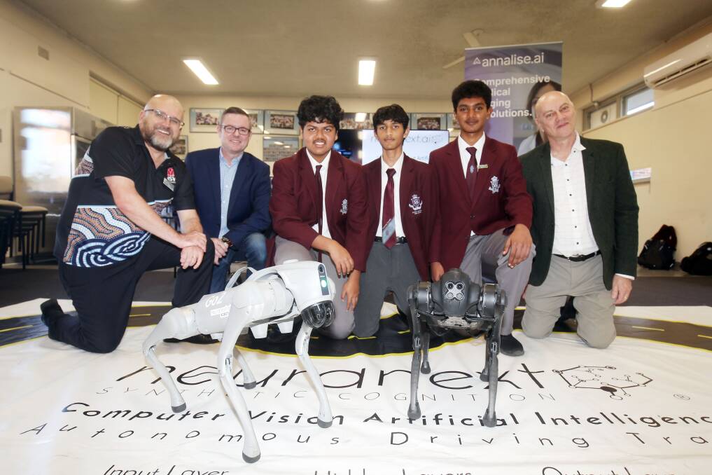 Neuranext Managing Director Adrian Tyson, and RIEP Senior Project Officer Trevor Adams bring AI to Sydney Technical High School, with careers adviser Jerry Mouzakis and students Uzair Ali, Abhijith Kumar and Parth Pratim Murali. The Stage 5 students are studying Information Software Technology. Picture by Chris Lane 