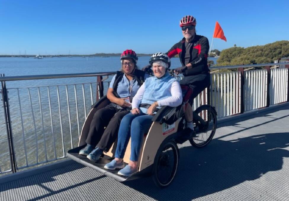 Residents enjoy a ride on a trishaw. Picture supplied