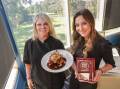 Chef Anita Lisson with Gina Louloudakis, who runs the kitchen at Sharks Kareela Cove Bar & Grill, and the winning regional Perfect Plate dish. Picture by John Veage