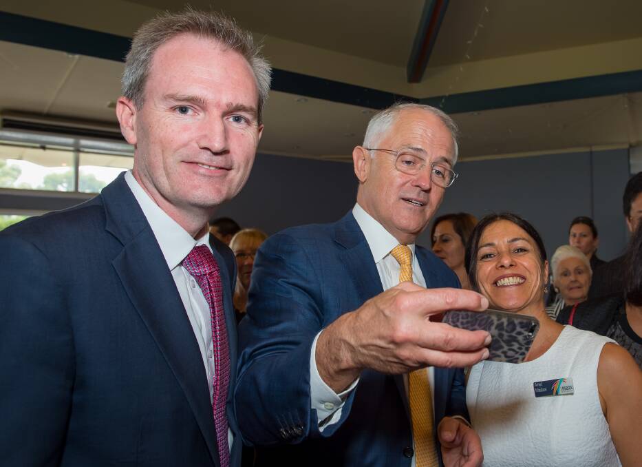 Afternoon tea: David Coleman (left) and Malcolm Turnbull posing for a "selfie" with  Amal Madani, director of community services at 3Bridges Community. Picture: supplied



