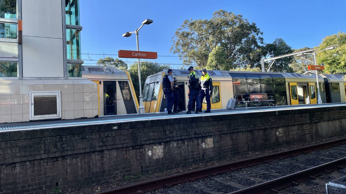 Police at Carlton station after the tragedy. Picture by Murray Trembath