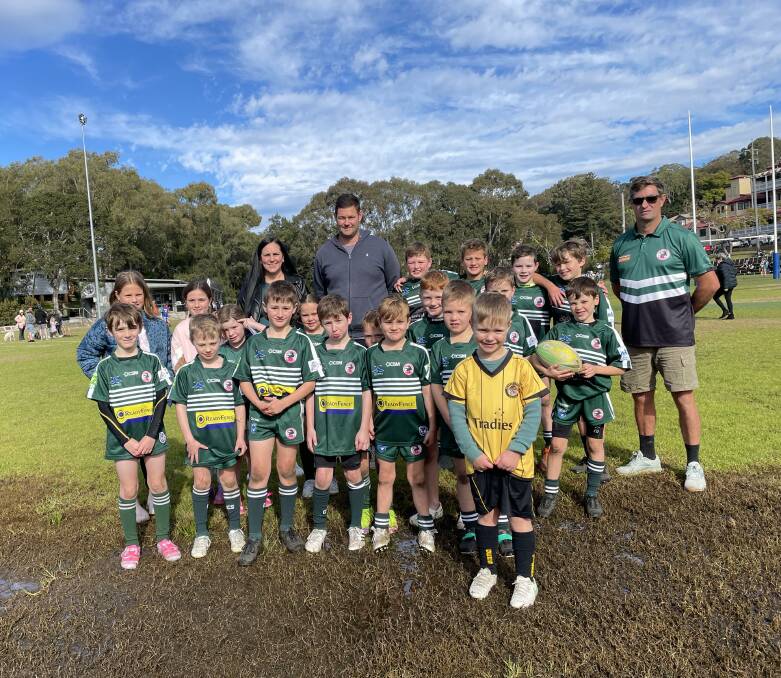 Cr Laura Cowell, Luke Notley and Como Crocodiles players and coach Ian Putterill on a waterlogged section of Scylla Bay Oval during a rare sunny day on the weekend. Picture by Murray Trembath