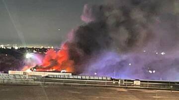Fire rips through the self-storage building at Kirrawee on Friday night. Facebook / Sam Day