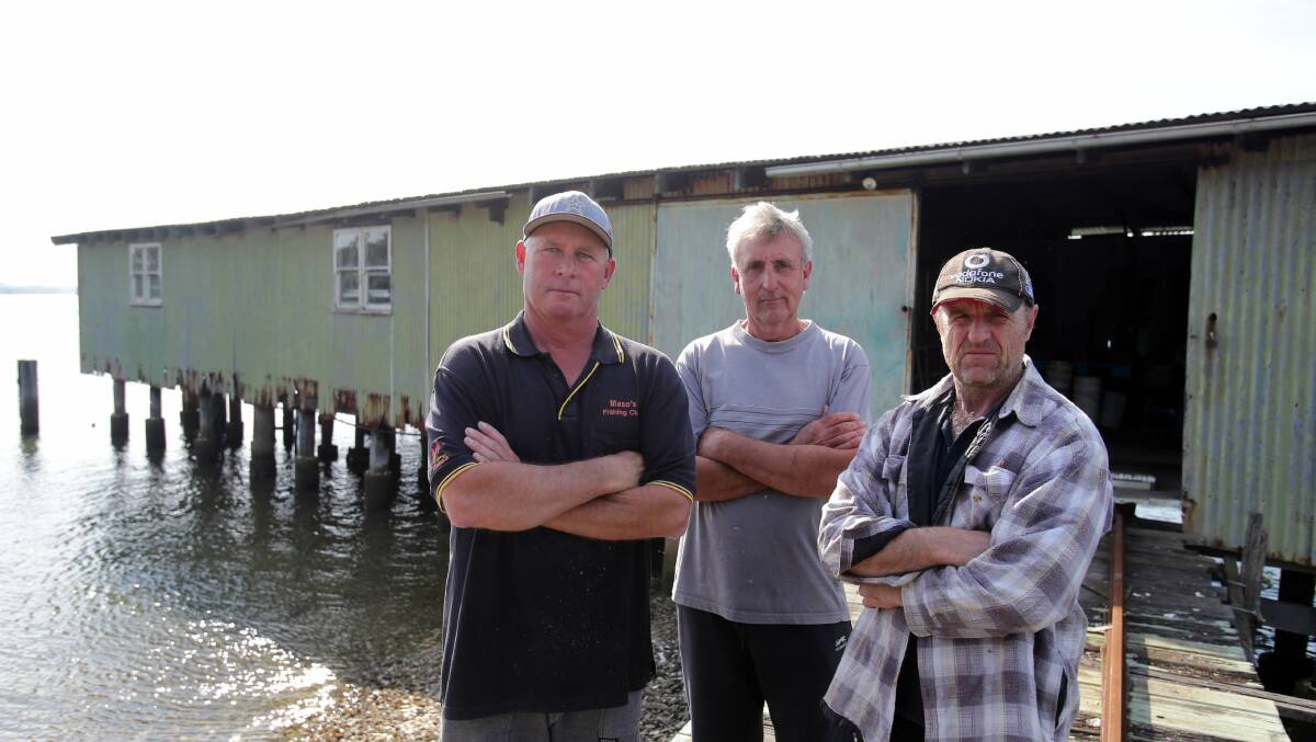 Ordered out: Keith Duggan (left) and Bob Hill, of Endeavor Oysters, and David Barker, of Wetland Oysters, in 2015. Picture: Chris Lane