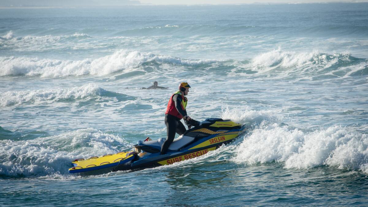 Andrew McKellar rides a rescue water craft (jetski) through the waves. Picture supplied