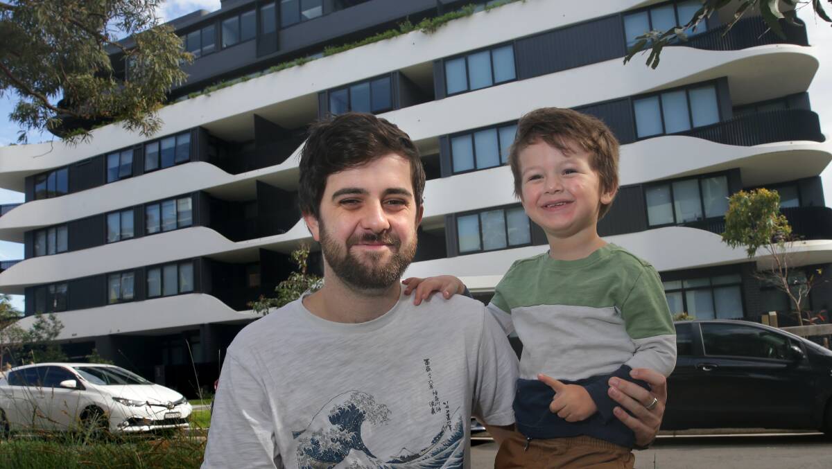 Jacob Trow and his son William, 3, who live alongside other essential workers and their families in a new affordable rental housing building at Miranda. Picture by John Veage