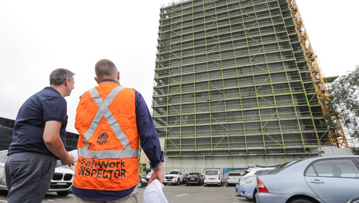 Head of SafeWork NSW, Trent Curtin and an inspector at a media conference at Hurstville. There is no suggestion work safety rules are not being observed on this project. Picture by John Veage