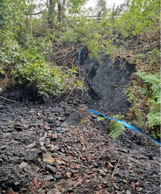 The landslip caused a section of embankment to wash down towards Camp Gully Creek, which flows into the Royal National Park. Picture supplied, NSW EPA
