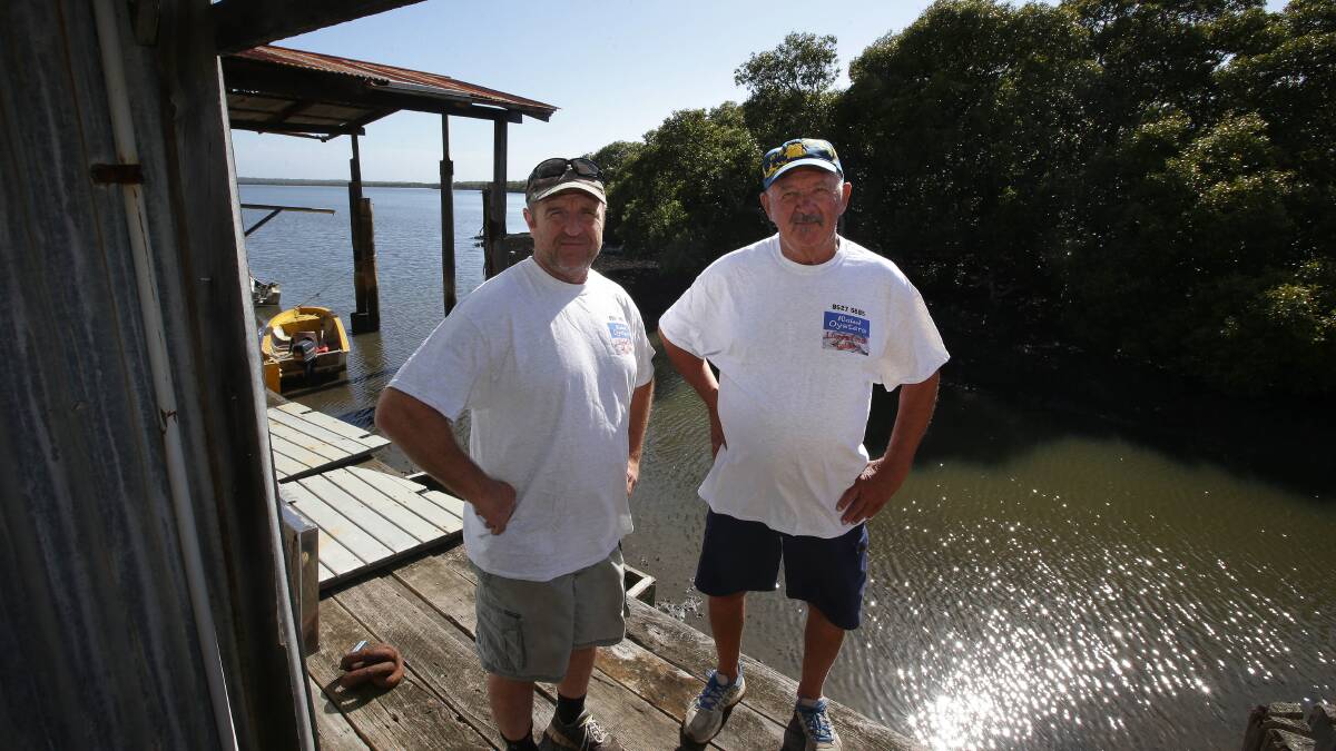 Lease delay: David Barker (left) and John Hedison operate Wetland Oysters. Picture: John Veage