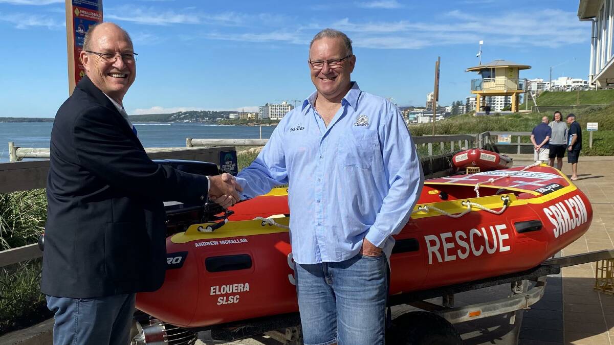 Andrew McKellar (right) and Elouera club president David Kowald at the launching of an IRB named after Mr McKellar. Picture supplied