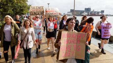 Protesters march against gender-based violence in Newcastle. Picture by Max Mason-Hubers