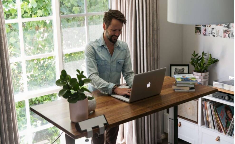 Beneifts of using a standing desk include helping to encourage healthier behaviour and lifestyle due to the additional movement in your body. Picture UpDown. 