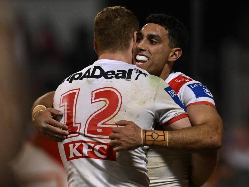 Tyrell Sloan (R) has had an impressing outing in the Dragons 16-point NRL trial win over the Tigers. (Dean Lewins/AAP PHOTOS)