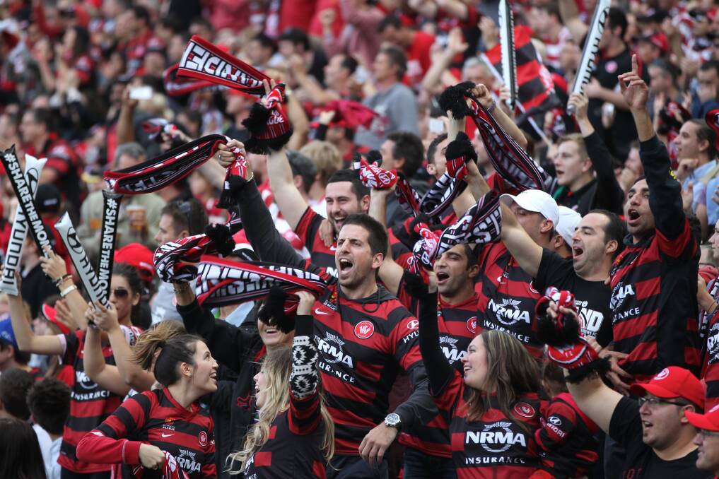 One voice: Western Sydney Wanderers fans sing for their team and their region.