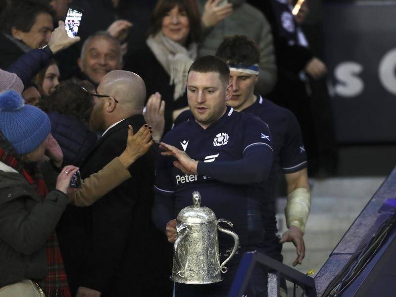 Finn Russell at Murrayfield with the Calcutta Cup after Scotland's historic win over England. (AP PHOTO)