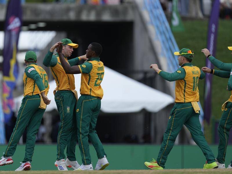 South Africa's Kagiso Rabada (third left) celebrates after dismissing American Nitish Kumar. (AP PHOTO)