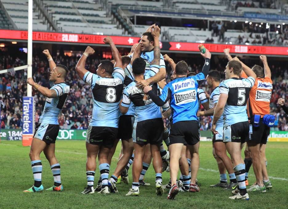 How sweet it is: Sharks players celebrate their win over Sydney Roosters at Allianz Stadium on Saturday night: Picture: Anthony Johnson