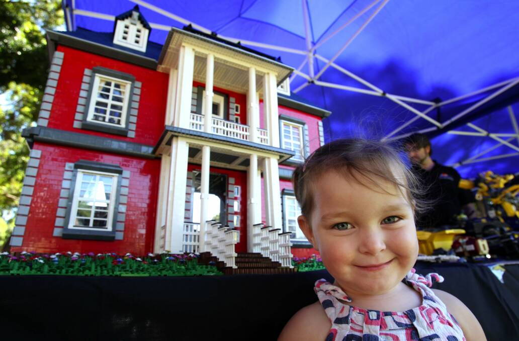 Inspired: Grace Gavan, 2, at the LEGO exhibition at the 2013 CreARTivity festival. Picture: John Veage