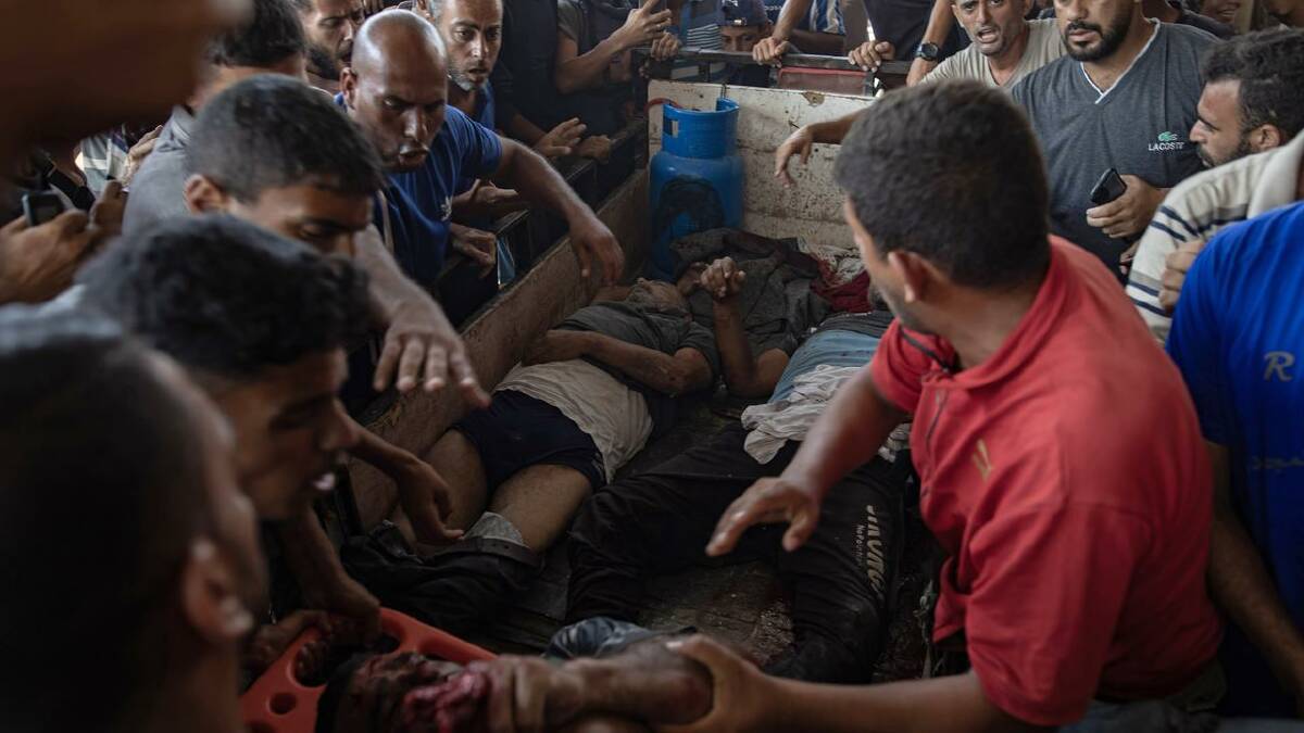 Injured people are taken to hospital after an Israeli bombing east of the Khan Younis camp. (EPA PHOTO)