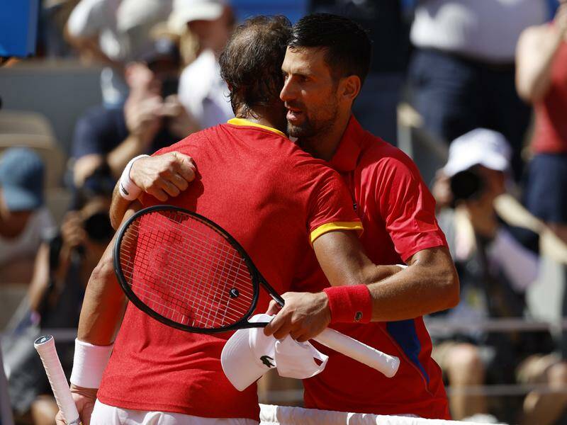 Rafael Nadal congratulates Novak Djokovic after the Serb won their eagerly-awaited Olympic clash. Photo: EPA PHOTO