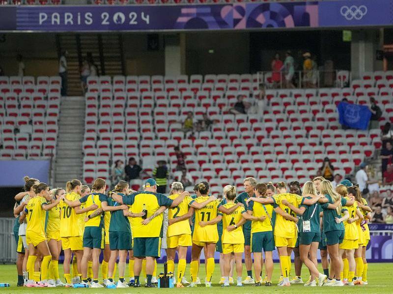 Australia's Matildas huddle on the pitch in Nice after their heart-stopping win over Zambia. Photo: AP PHOTO