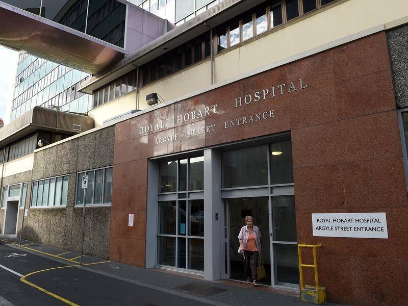 A woman is being treated at Royal Hobart Hospital after testing positive to the coronavirus.
