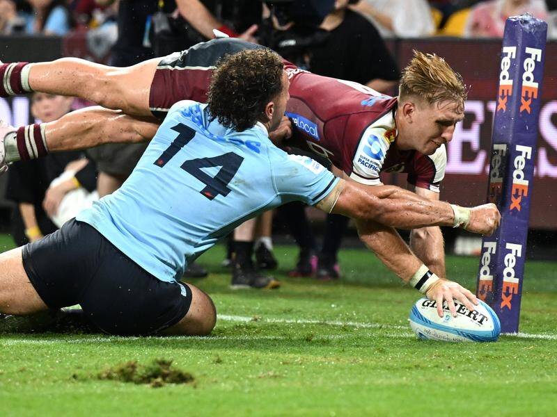 Tate McDermott was one of four Reds tryscorers their 40-22 win over the Waratahs in Brisbane. (Darren England/AAP PHOTOS)
