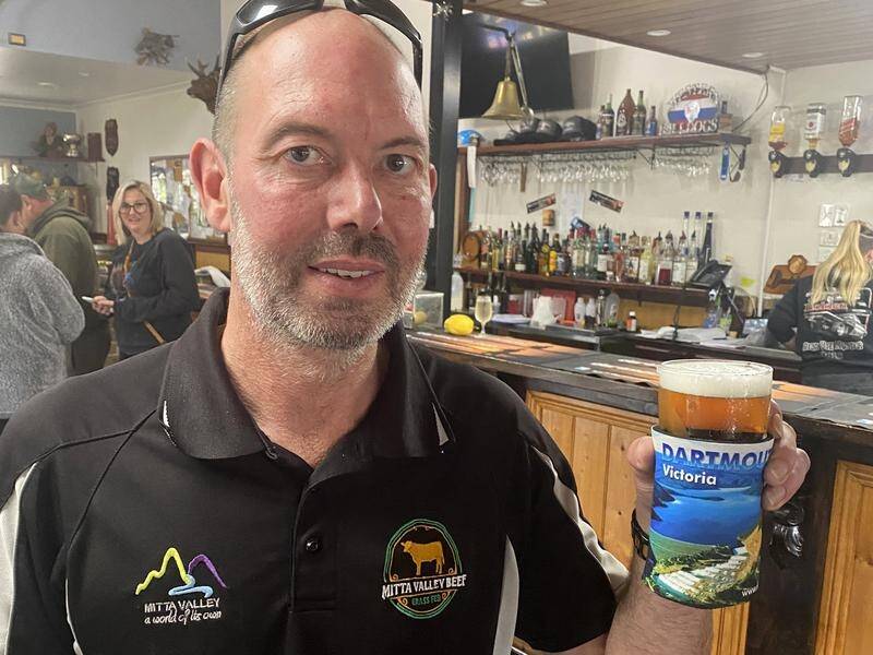 Dartmouth publican Aaron Scales had commemorative stubbie holders made for the expected dam spill. (PR HANDOUT IMAGE PHOTO)