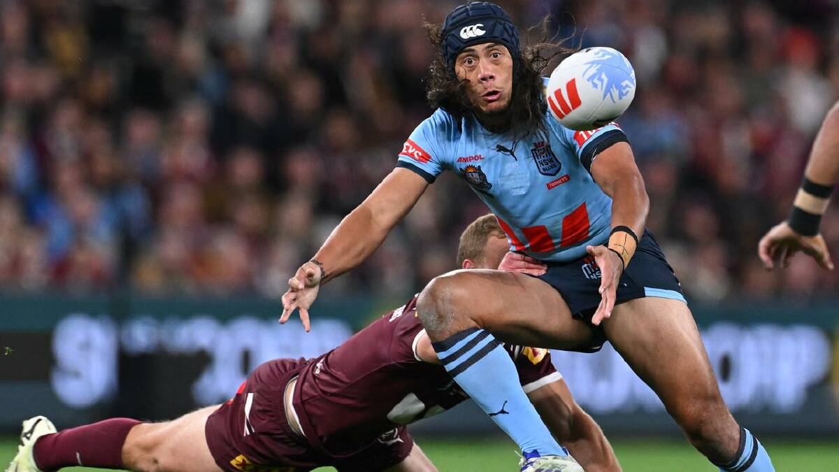 Jarome Luai, of the Blues, fights for the ball against the Maroons in State of Origin III.  (Dave Hunt/AAP PHOTOS)