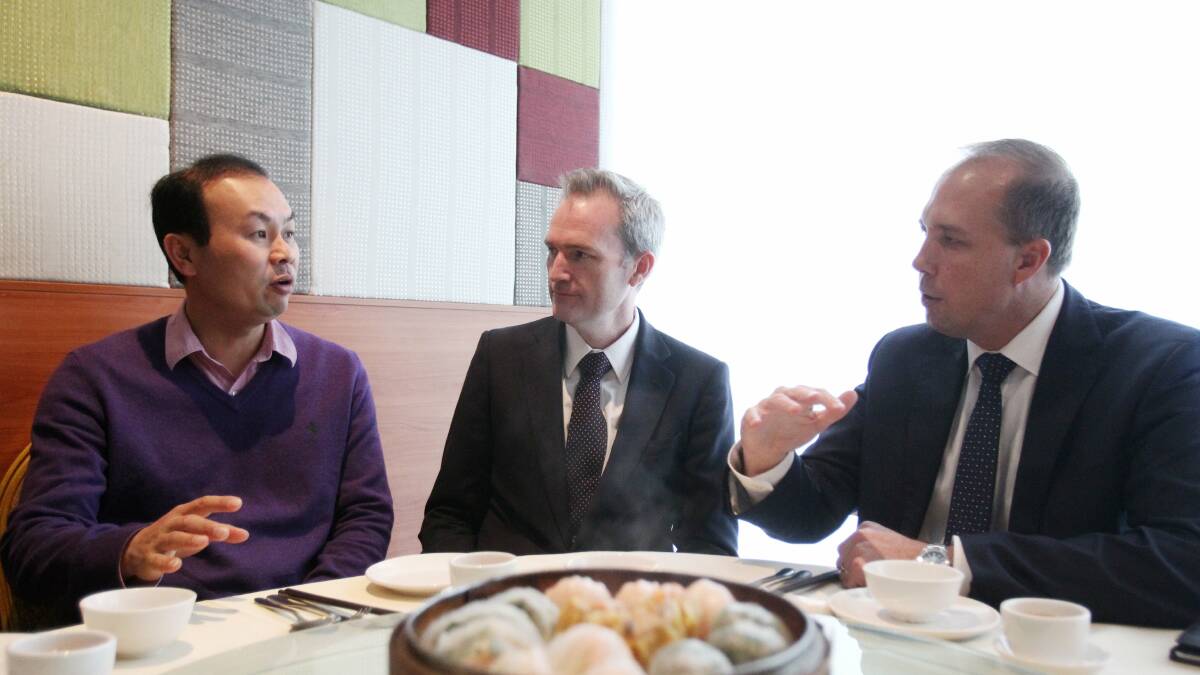 Tell the minister: Sunny Chang talks to immigration minister Peter Dutton and David Coleman. Picture Chris Lane