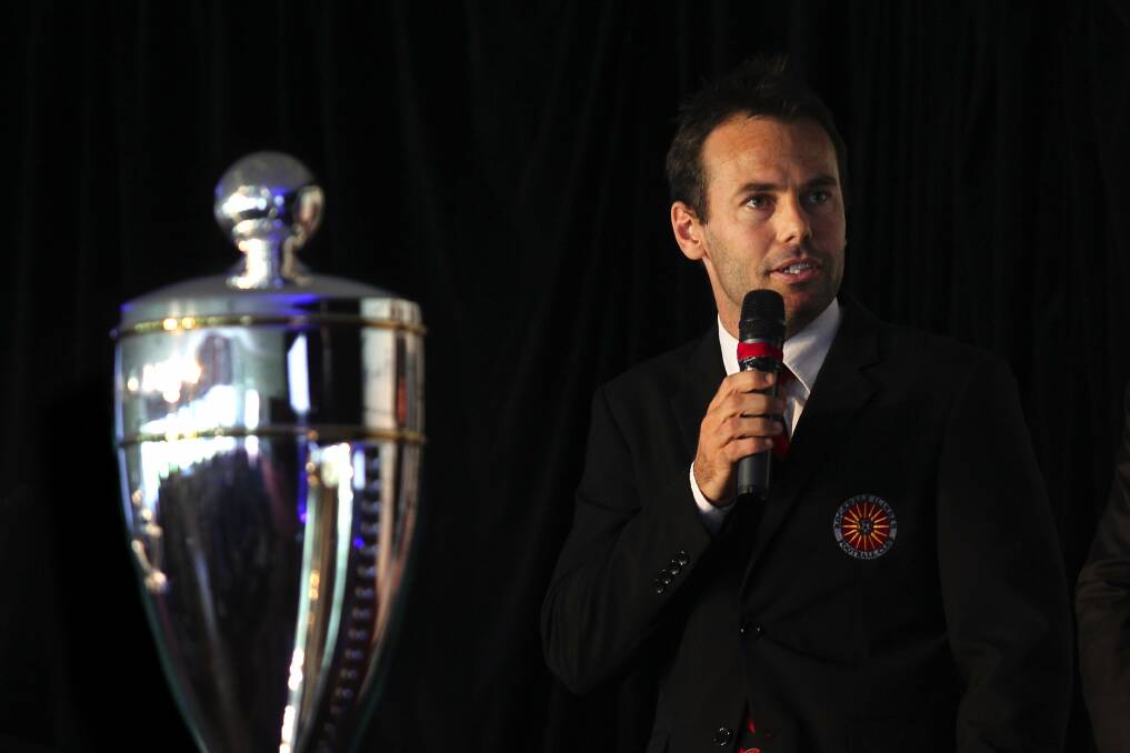 Game on: Former Socceroos and A-League player Paul Reid, now playing with Rockdale City Suns, speaks at the launch of the inaugural FFA Cup competition alongside the new FFA Cup trophy. Picture: John Veage